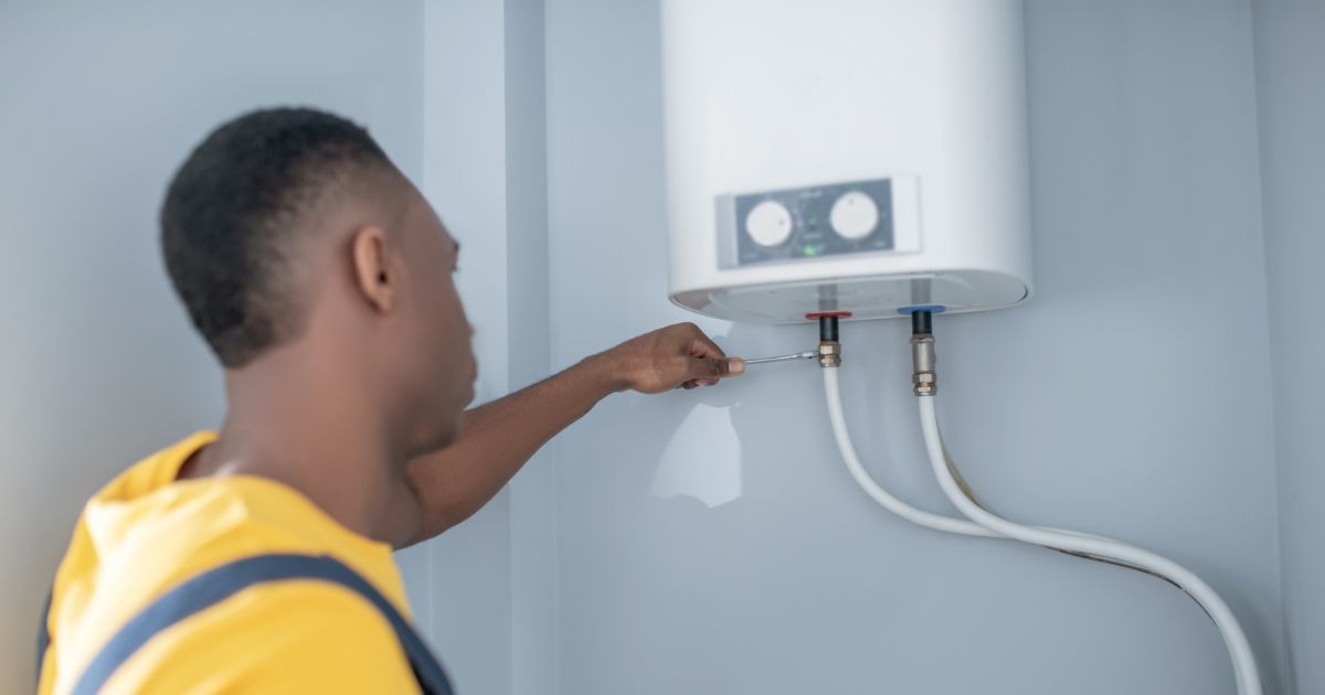 Repairman Fixing the Water Heater