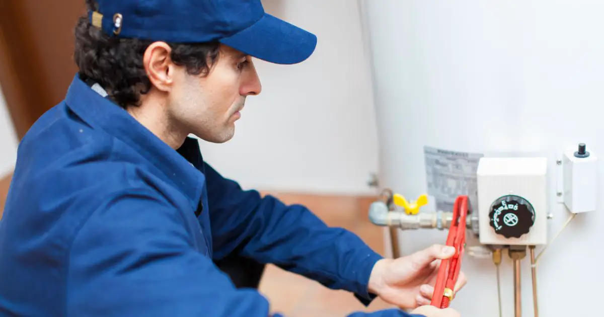 plumber fixing an hot water heater